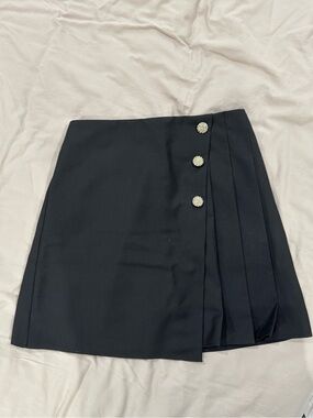 Black Mini Skirt with Side Pleats and Decorative Buttons